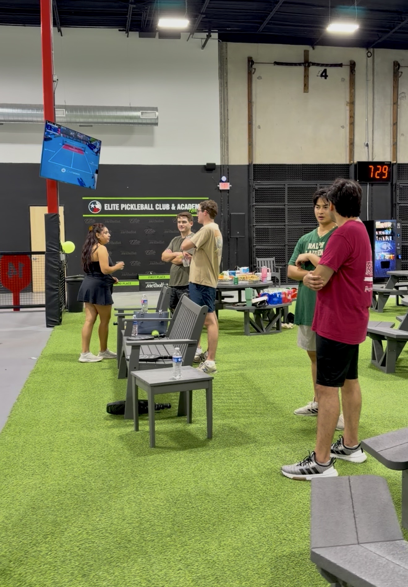 Attendees socializing at pickleball